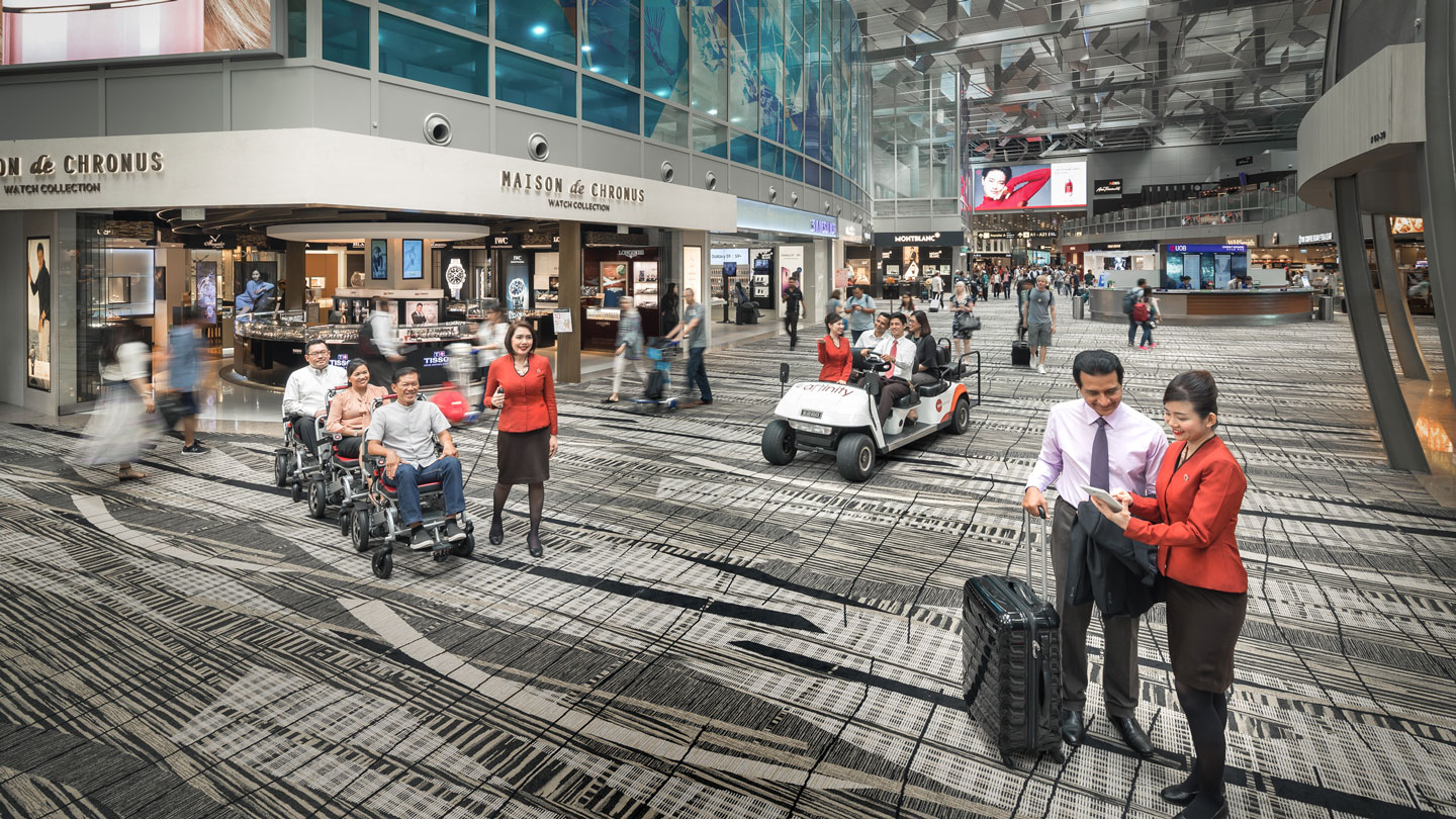 Customer service officers attending to passengers in Changi airport