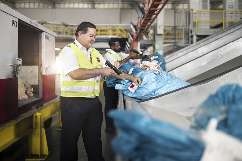 Air Cargo personnel scanning cargo label