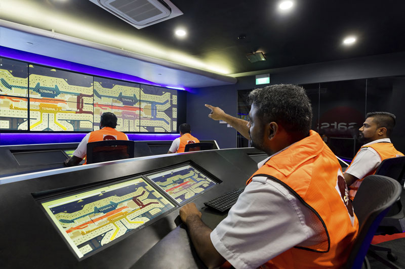 Two technical ramp personnel looking at computer screens