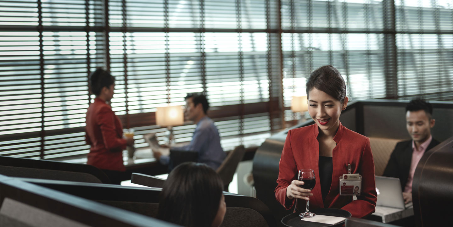 Customer service officer serving passengers at lounge